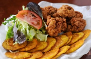 120203-NORCROSS-GA- John Kessler's weekly dine review of Cafe Dominican on Friday February 3, 2012. FOOD: Chicharron de Pollo- fried chicken pieces with a side of plantain.(BECKY STEIN/special)